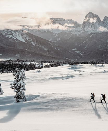 Hiking on the Villanders mountain pasture in winter