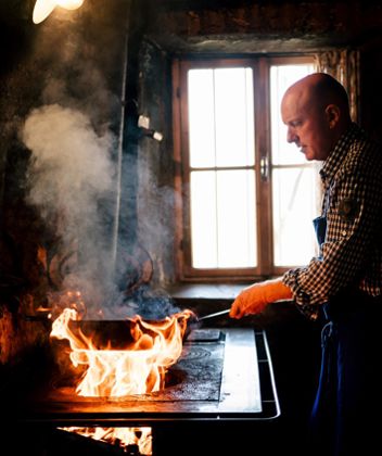 A farmer at the stove