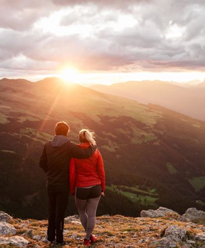 A couple looks at the sunset