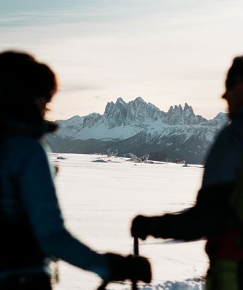 Two peoople enjoying the winter panorama