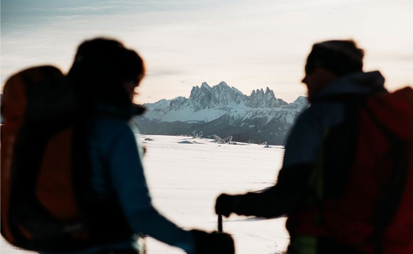 Two peoople enjoying the winter panorama