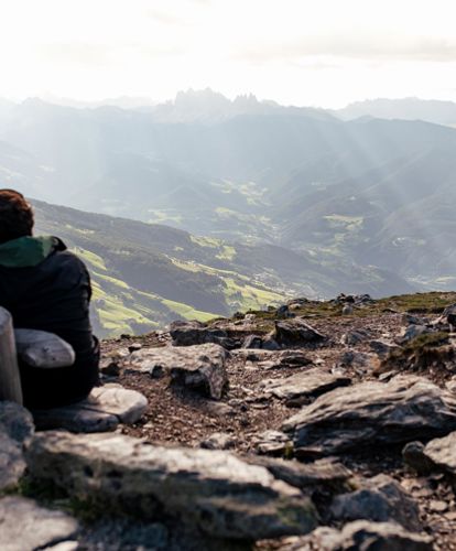 Two hikers enjoy the view in summer