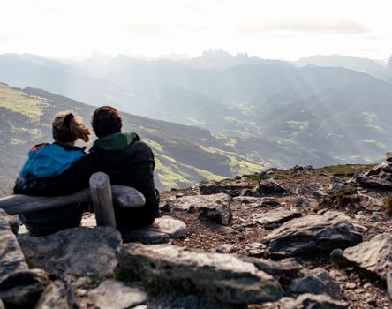 Two hikers enjoy the view in summer