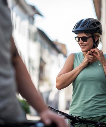 A woman with a bike helmet