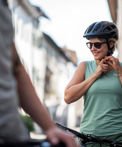 A woman with a bike helmet